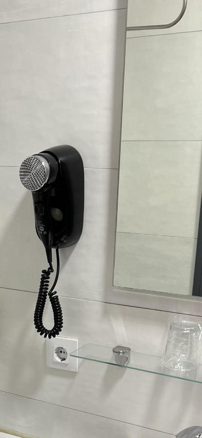 Hostal Paco'S Seville Exterior photo A wall-mounted hair dryer
